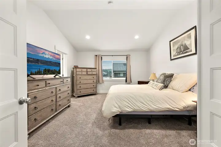 Primary bedroom, also very spacious, vaulted ceilings and so much room for bedroom furniture!