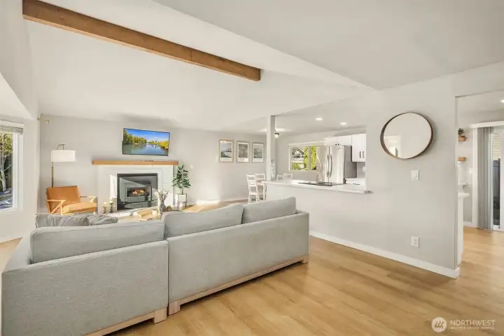 Bright & spacious living area with seamless flow between kitchen, dining & living room.