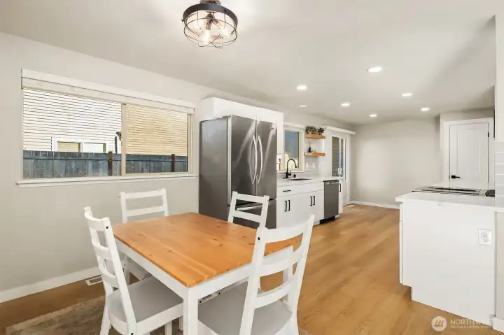 Dining area leading to spacious kitchen.