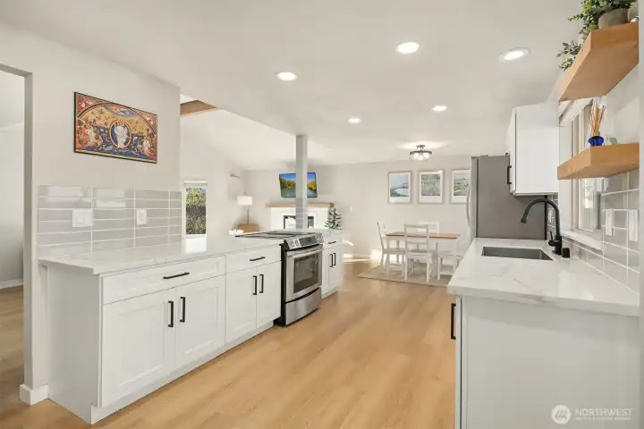Spacious kitchen leading overlooking living area.