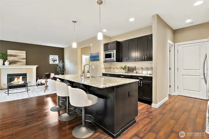 Spacious kitchen with island that offers seating.