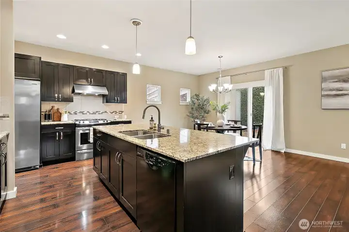 Open kitchen with large island, perfect for gatherings.