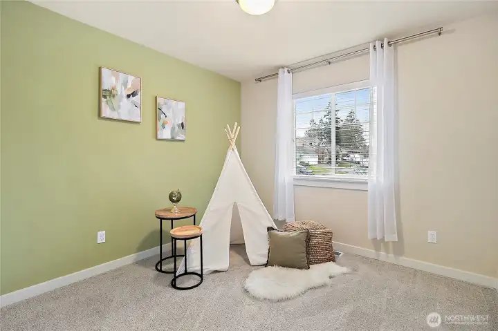 Comfortable bedroom with natural lighting.