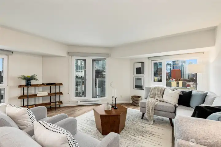 Windows wrap the living room and showcase the iconic Seattle views. Step outside on the corner deck for fresh air enjoyment.