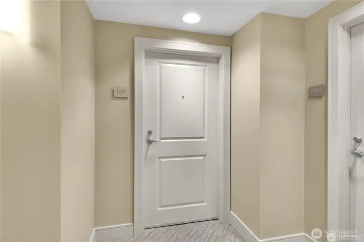 Entry door to Unit 1101 at The Cosmopolitan in Seattle.