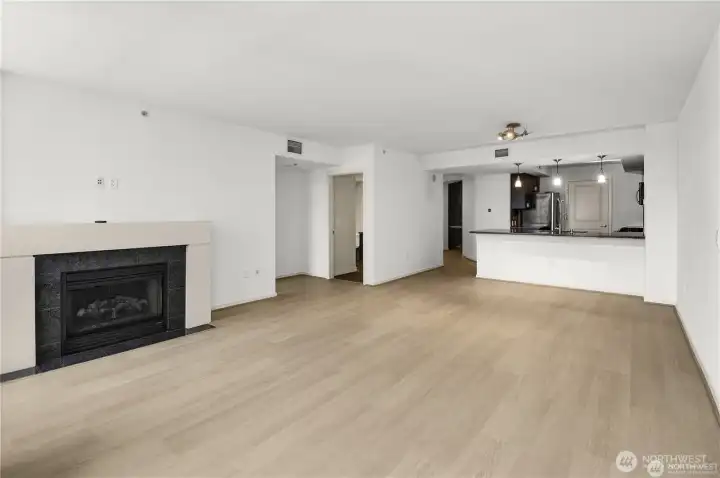 A sleek built-in fireplace adds warmth, style, and a cozy ambiance to the modern space.