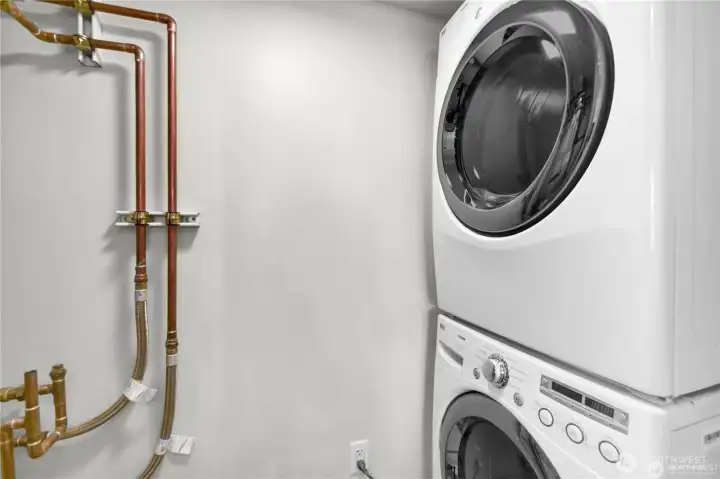 In Unit Laundry. A modern, front-loading stacked washer and dryer provide maximum efficiency while saving space.