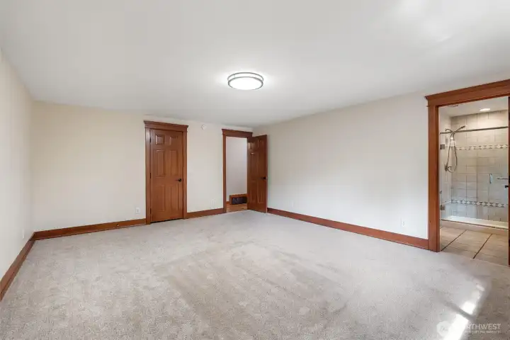 Enjoy this expansive primary suite with a clean, move-in-ready feel & direct access to a private ensuite bath