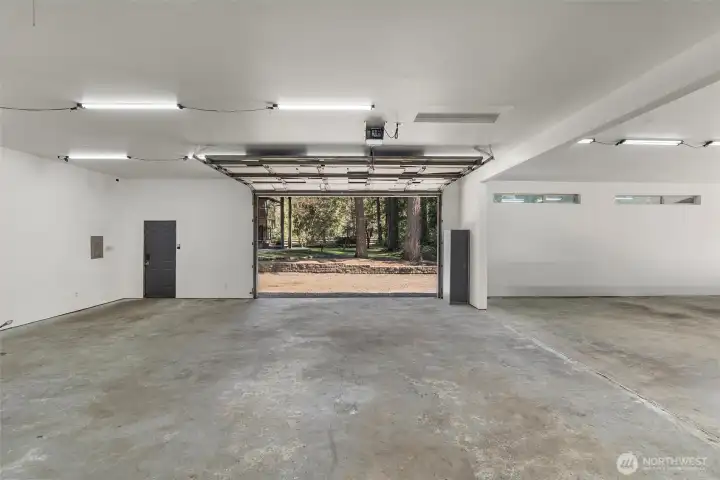 Spacious interior with roll-up door—ideal for vehicles, equipment, or projects