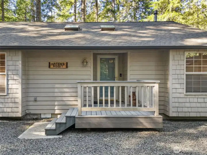 Entry porch with covered entry alcove.