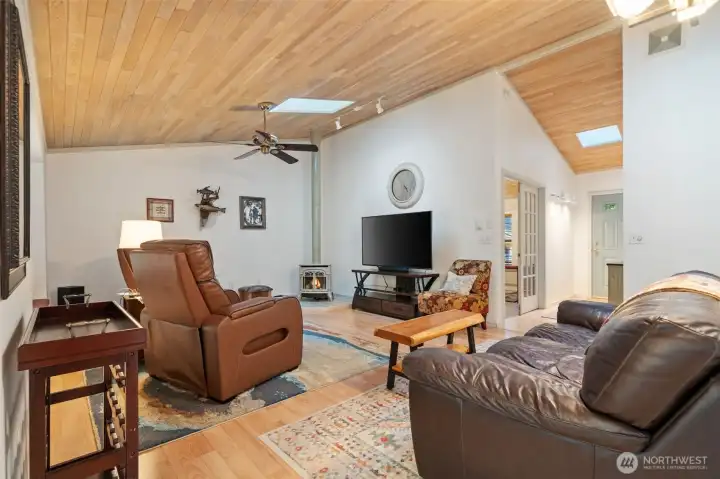 Living room w/gas stove, entry hall on right