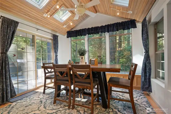 Dining room w/large slider to deck, windows on other sides & 4 skylights!