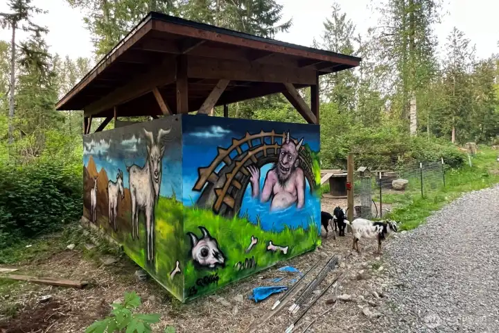 Goat pen with whimsical mural.
