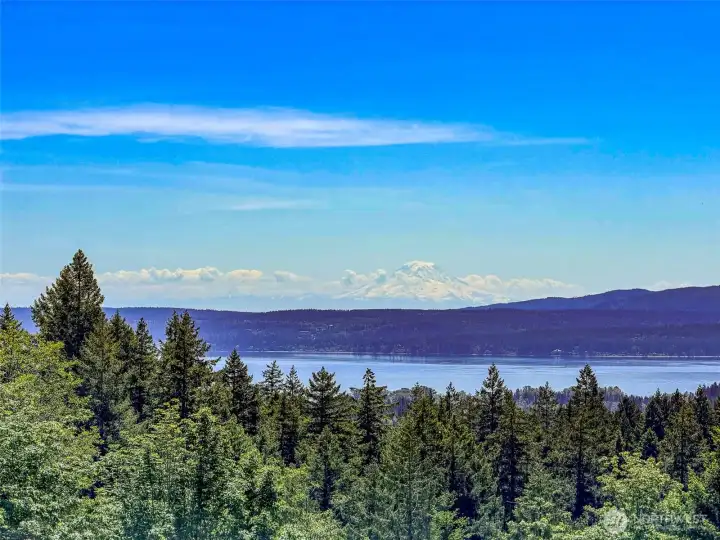 Views to the SE of Hood Canal and Mt Rainier.. Watch the sunrise over the Cascades and set over the Olympic Mtns.  What a day !