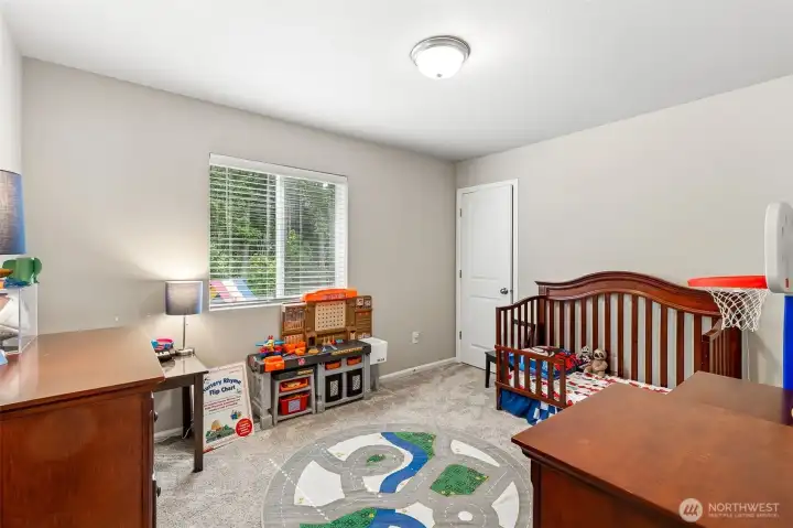 3rd bedroom with walk in closet overlooking the back yard with territorial view 3rd bedroom with walk in closet overlooking the back yard with territorial view