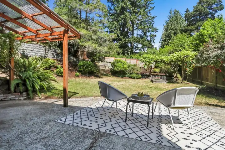 Spacious patio with covered BBQ area. Spacious patio with covered BBQ area.