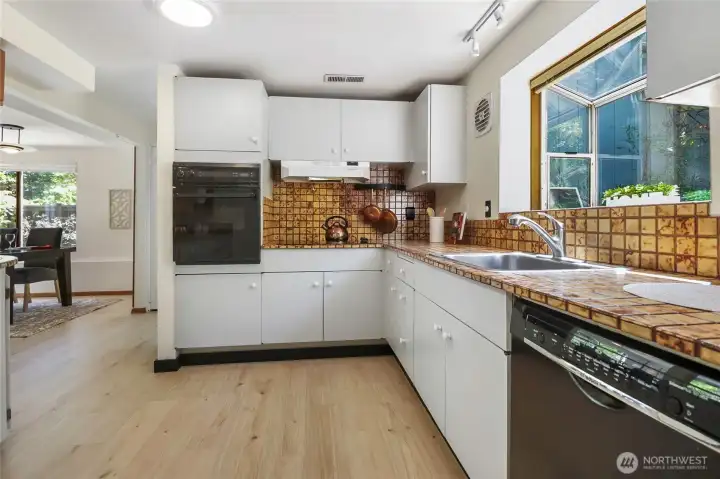 Spacious kitchen with lovely pop out window. Spacious kitchen with lovely pop out window.