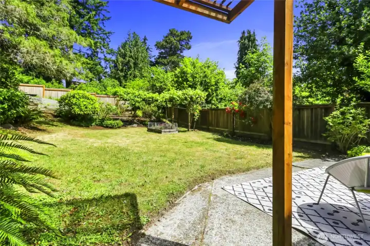 View of backyard from covered BBQ area. View of backyard from covered BBQ area.
