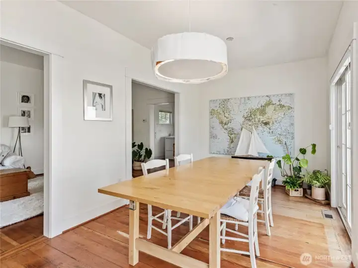 Dining room with fir flooring throughout.