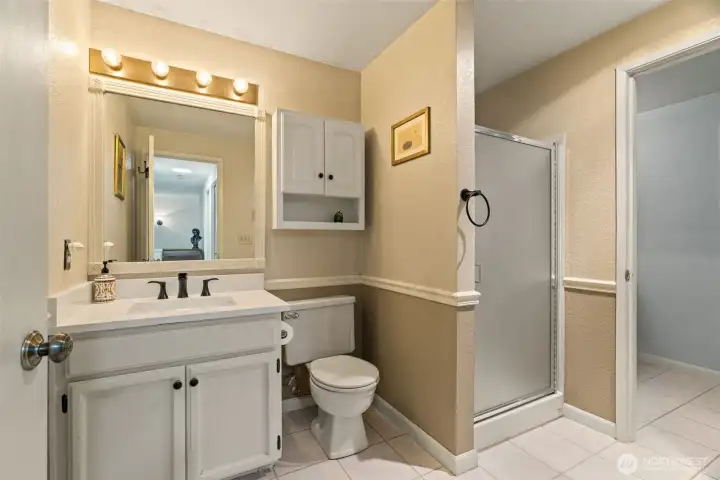 Upper level guest bath that connects to primary bath Upper level guest bath that connects to primary bath