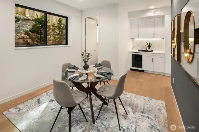 Dining with wet bar and wine fridge for entertaining