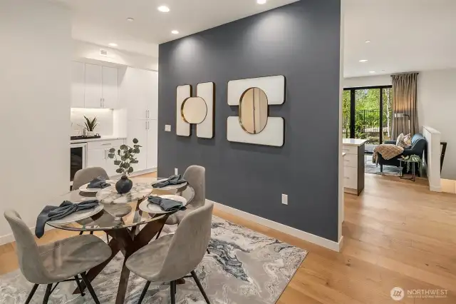 The dining room is thoughfully set apart from the living area while maintaining an open-concept design