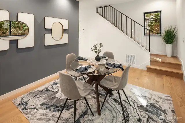 Elegant dining space with nearby half bath and easy access to upper floors.