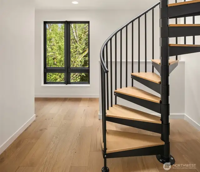 Stairs to rooftop living space. Interior photos are from the Model Unit at Lot 8 (298 118th Ave SE) at the same project.
