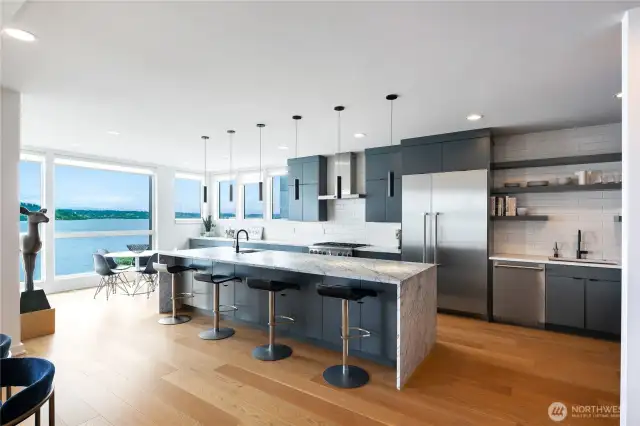 Top shelf commercial grade appliances, separate breakfast area + center island seating and storage.