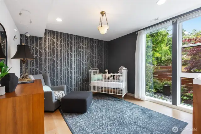 One of four large bedrooms, large walk-in closet, exceptional light with a treed outlook.