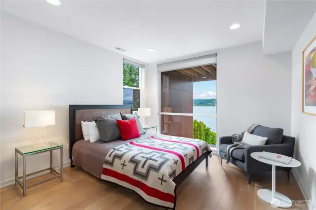 Second of four bedrooms with lake views and large walk-in closet.