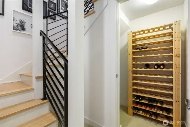 Central staircase, middle floor landing with wine storage or general purpose closet.