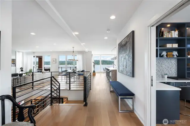 Front entry with large, private office to the right. Open architecture maximizes views. Wide, Oak plank flooring throughout.
