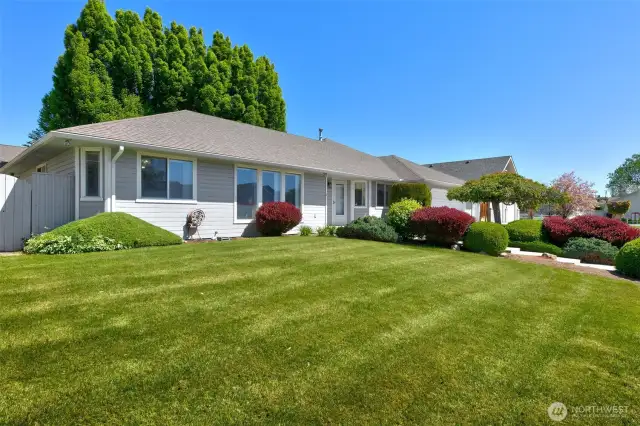 Angle view of front of house, from SW corner of lot (streetside)