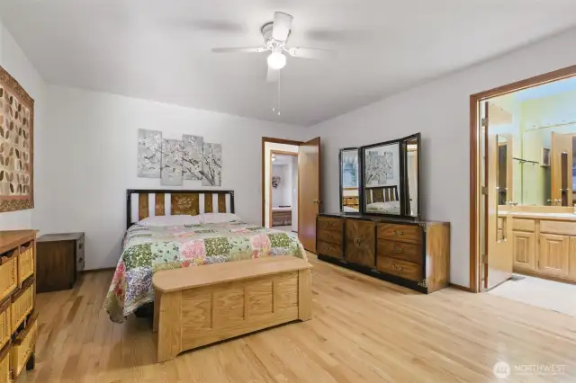 Primary bedroom with view of primary bathroom