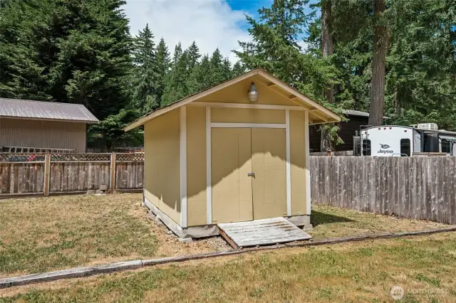 Large storage shed with 2 separate sides.