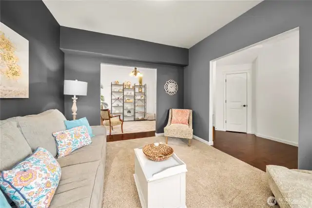 First living space as seen from the window. Beyond is the formal dining room with the front entrance and large under-the-stair closet on the right.