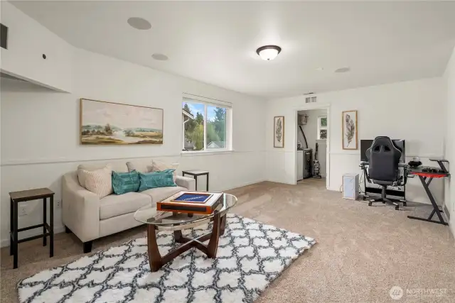Third living space at the top of the stairs! With the laundry room beyond, this space has countless options!