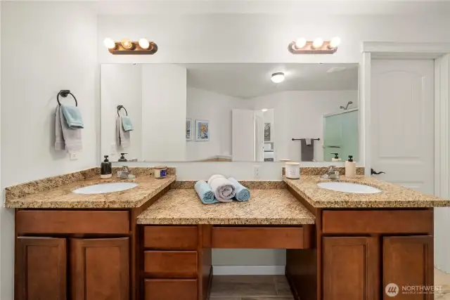 This double vanity includes a central space at the perfect height for a chair, making getting ready in the morning a dream!