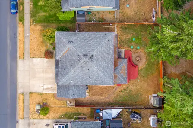 Aerial view of the property shows a good view of the roof and outdoor living spaces!