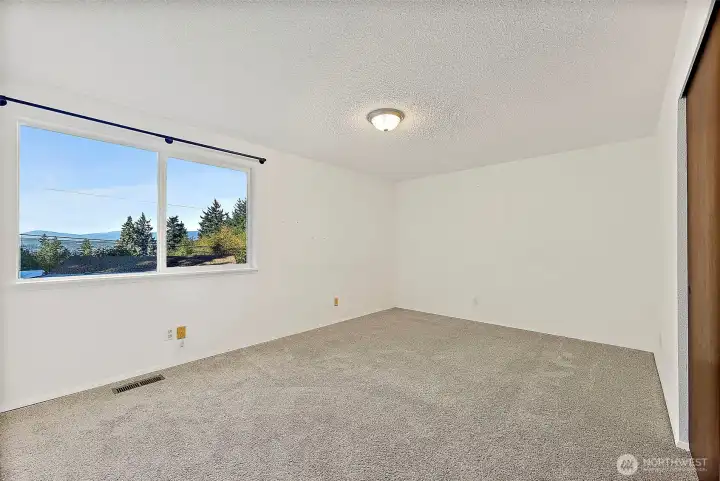 Primary bedroom has views of Mtns & Sound too!