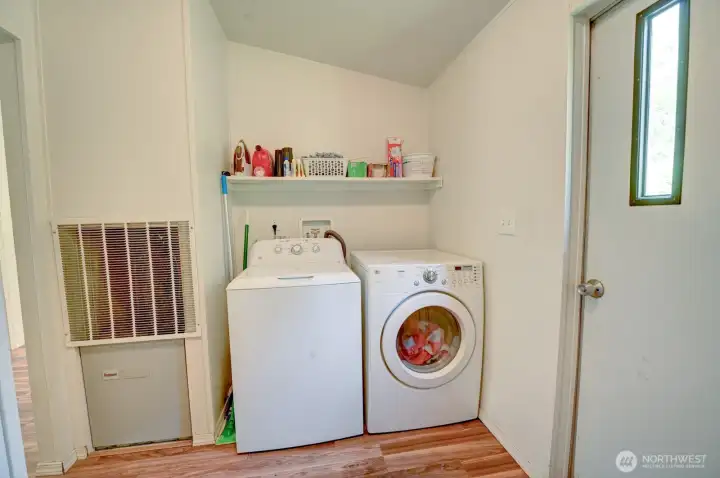 Utility room with access to backyard