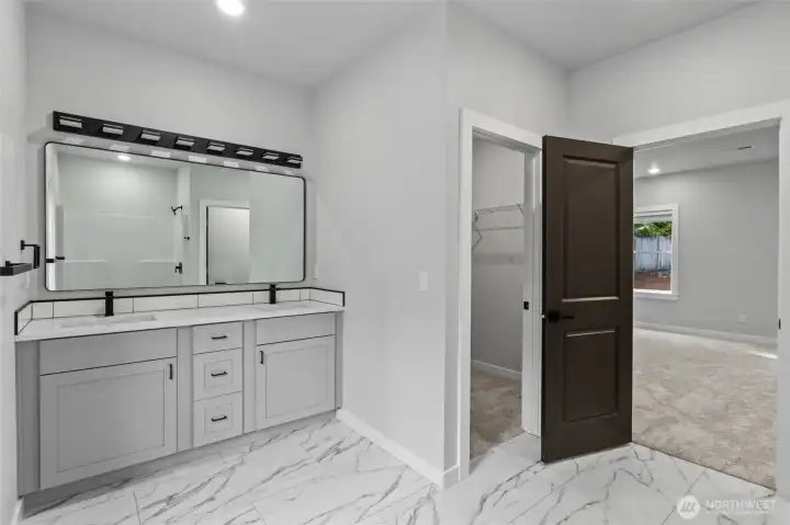 Main bath with double sinks spacious walk in closet