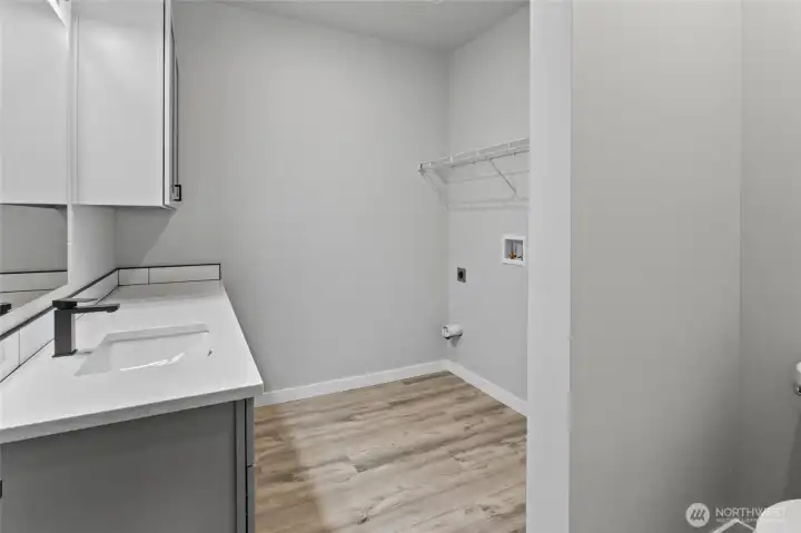 Utility room with 2/5 bath, builder is providing new GE washer and dryer