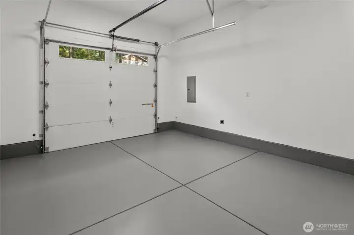 Finished garage with sealed flooring.