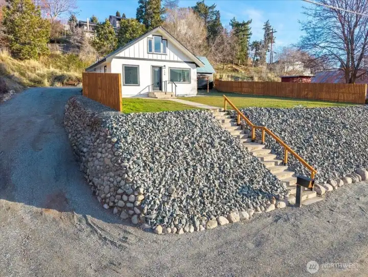 Fully remodeled 1930s home with a nice large flat yard—perfect for relaxing and soaking in sweeping Lake Chelan views. The spacious outdoor setting is ideal for adding a hot tub or pool, creating your own private retreat to fully enjoy everything the valley has to offer.