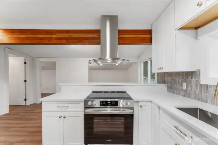 Just off the kitchen, you’ll find the dining area and a versatile bonus space—perfect for creating the setup you need, whether for entertaining, working from home, or extra living space.