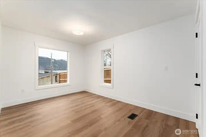 The primary bedroom features the same updated finishes found throughout the home, creating a modern, cohesive, and inviting retreat.