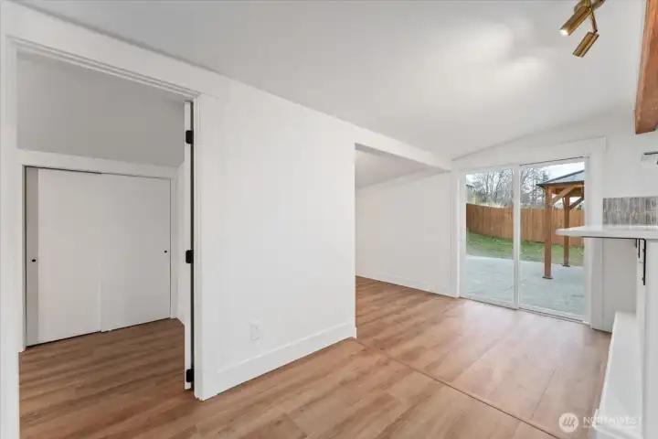 The second bedroom on the main floor is located just off the kitchen and dining area, to the left. To the right, you’ll find the dining area.