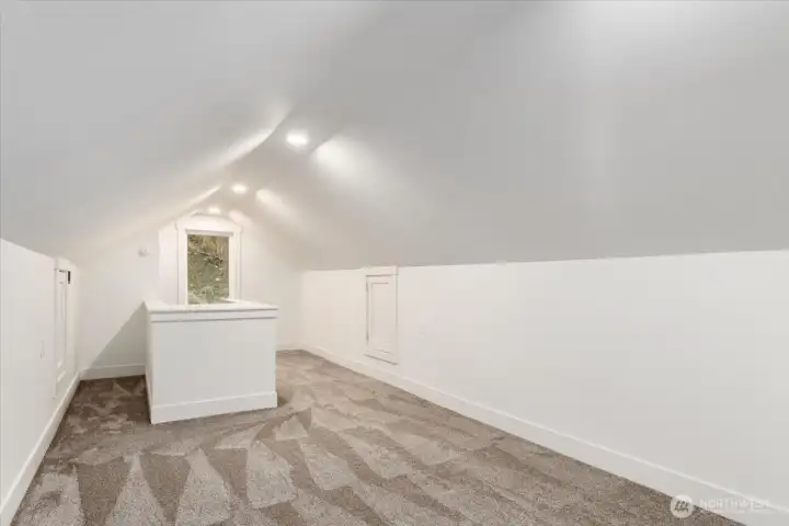The upstairs loft has been fully updated and features fresh carpet, making it a versatile space perfect for an additional bedroom, recreational area, or whatever suits your needs.